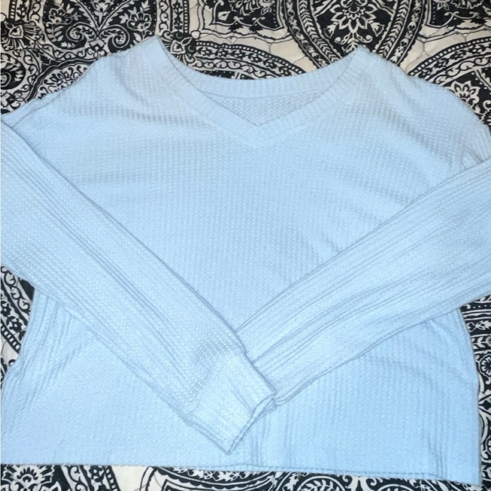 light blue sweater